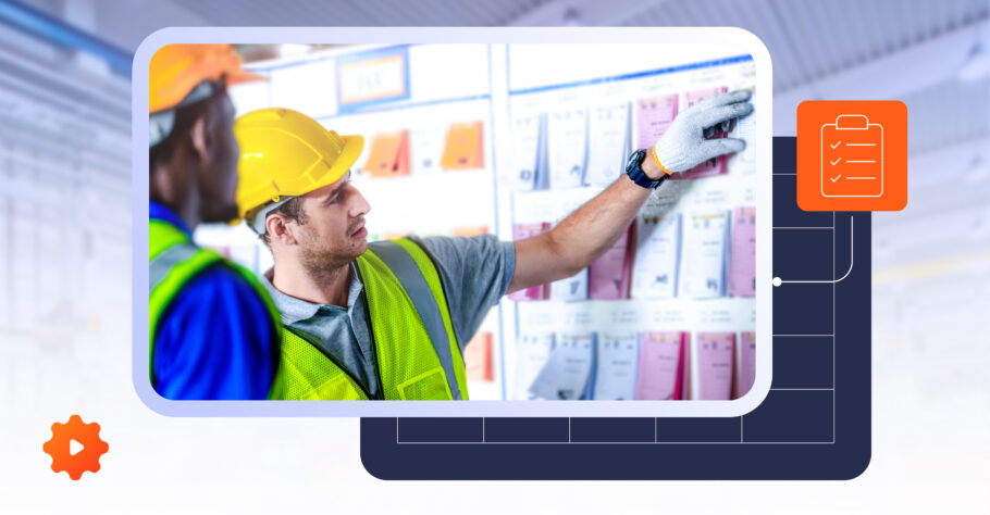 Two workers in safety vests use Visual Management to review tasks and progress via a Kamishibai Board, enhancing oversight.